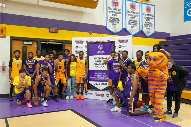 Washington Unified Basketball team with National Banner
